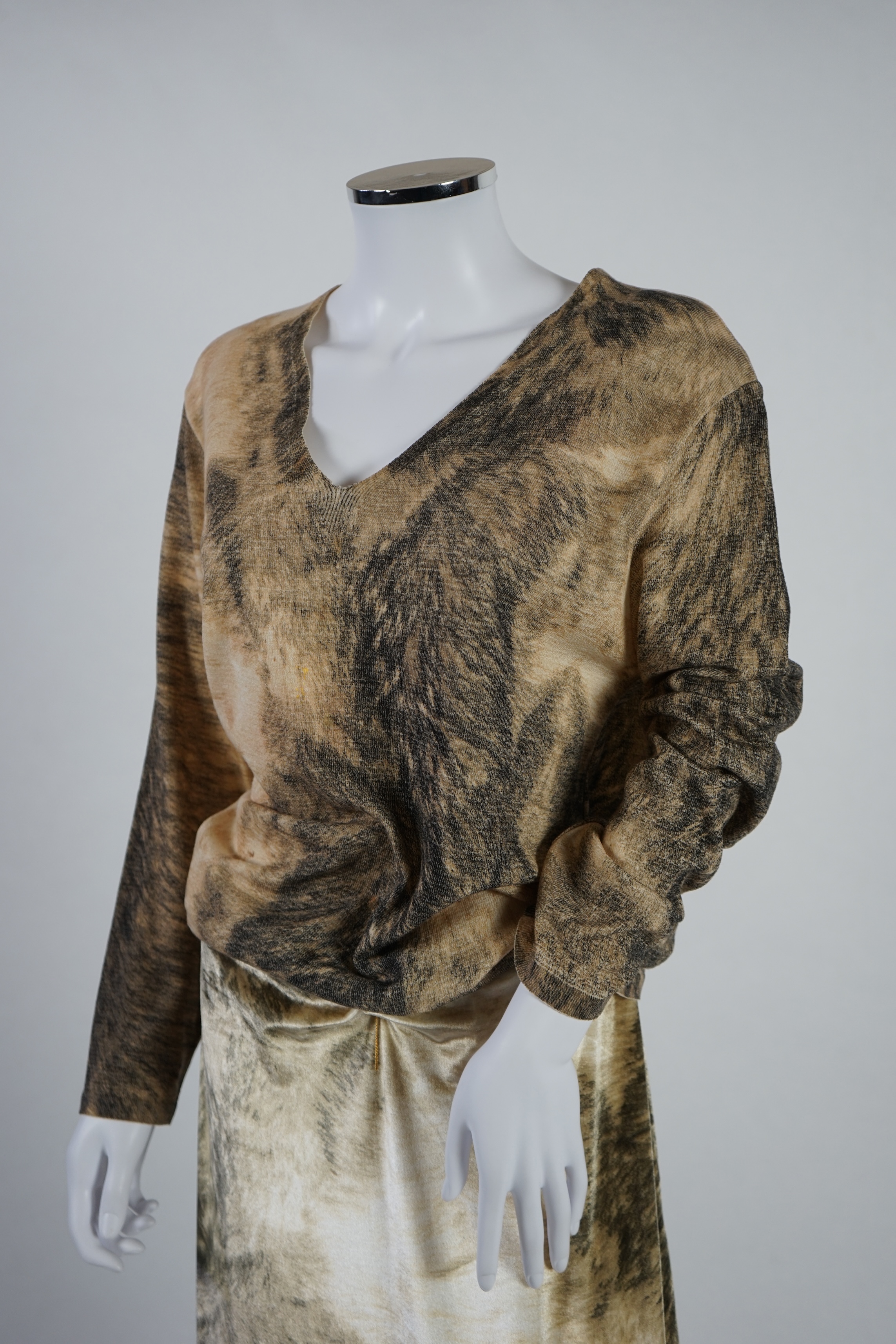 A Roberto Cavalli skirt with matching v neck sweater. Size 14-16 Proceeds to Happy Paws Puppy Rescue